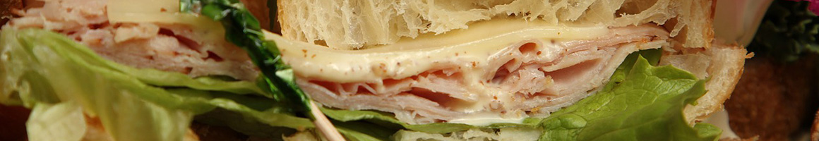 Eating Sandwich at Bagel Stop & Deli restaurant in Wayne, NJ.